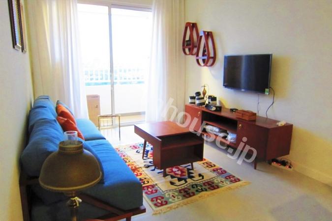 A spacious living area decorated with colorful furniture in Lexington Dist 2.